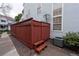 Back of the house showing a wood fence and AC unit at 12242 Bannock Cir # D, Denver, CO 80234