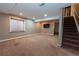 Spacious basement with carpet flooring, recessed lighting, and a window at 12242 Bannock Cir # D, Denver, CO 80234
