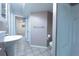Basement bathroom with a toilet, sink and a shower at 12242 Bannock Cir # D, Denver, CO 80234