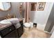 Elegant bathroom featuring a vanity with designer fixtures, and a combination bathtub and shower at 12242 Bannock Cir # D, Denver, CO 80234