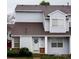 Charming townhouse exterior featuring a wreath on the door and well-maintained landscaping at 12242 Bannock Cir # D, Denver, CO 80234