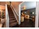 Hallway view towards a living room, showcasing a staircase at 12242 Bannock Cir # D, Denver, CO 80234