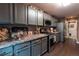 Well-equipped kitchen boasts stainless steel appliances, gray cabinetry, and plenty of counter space at 12242 Bannock Cir # D, Denver, CO 80234