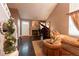 Cozy living room featuring a fireplace, piano, and comfortable seating at 12242 Bannock Cir # D, Denver, CO 80234