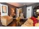 Inviting living room features hardwood floors, stylish furnishings, and multiple doorways for easy access at 12242 Bannock Cir # D, Denver, CO 80234