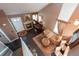 Elegant living room with a fireplace, piano, and lots of natural light from the skylight at 12242 Bannock Cir # D, Denver, CO 80234