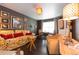 Stylish living room features hardwood floors, comfortable seating, decorative lighting, and ample natural light at 12242 Bannock Cir # D, Denver, CO 80234