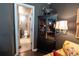 Comfortable living room with adjacent half bathroom and decorative shelving at 12242 Bannock Cir # D, Denver, CO 80234