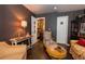 Well-decorated living room features hardwood floors, stylish furnishings, and doorways for access to other rooms at 12242 Bannock Cir # D, Denver, CO 80234