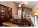 Comfortable office with built in bookshelf and vaulted ceilings with a ceiling fan at 12242 Bannock Cir # D, Denver, CO 80234