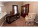 Charming office space with a large desk, built in book shelves, and a comfortable chair at 12242 Bannock Cir # D, Denver, CO 80234