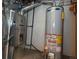 Basement utility area featuring an updated furnace and water heater at 12242 Bannock Cir # D, Denver, CO 80234