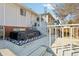 Back deck with white railing overlooking the backyard at 8280 Everett Way, Arvada, CO 80005