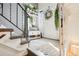 The entryway features a decorative wreath, shoe storage, and decorative greenery at 8280 Everett Way, Arvada, CO 80005