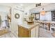 Charming kitchen featuring granite counters, an island, and rustic accents at 8280 Everett Way, Arvada, CO 80005