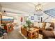 Finished basement living room features a cozy seating area with a large flat screen television at 8280 Everett Way, Arvada, CO 80005