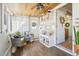 Beautiful sun room with modern furnishings and decor, and hardwood floors at 8280 Everett Way, Arvada, CO 80005