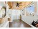 Bright sun room with wood ceiling, hardwood floors, and lots of natural light at 8280 Everett Way, Arvada, CO 80005