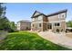 Well-manicured lawn and patio area in a spacious backyard at 11985 Singing Winds St, Parker, CO 80138
