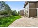 Spacious backyard featuring a well-maintained lawn and patio at 11985 Singing Winds St, Parker, CO 80138