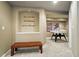 A well-finished basement hallway with a wooden bench, baseball memorabilia and ping pong table at 11985 Singing Winds St, Parker, CO 80138