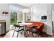 Eat-in kitchen nook with a round table, unique chairs, and a view of the patio at 11985 Singing Winds St, Parker, CO 80138