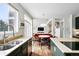 Updated kitchen boasts bright countertops, stainless steel appliances and eat-in nook at 11985 Singing Winds St, Parker, CO 80138