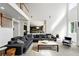 Bright living room featuring a spacious layout, modern furnishings, and seamless flow to other areas at 11985 Singing Winds St, Parker, CO 80138