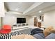 Cozy living room with modern decor, television and seating arrangement at 11985 Singing Winds St, Parker, CO 80138