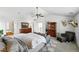 Spacious main bedroom suite features an ensuite bath and sitting area with comfortable sofa at 11985 Singing Winds St, Parker, CO 80138
