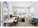 Bright home office featuring a large desk, comfortable chair, and natural light from the window at 11985 Singing Winds St, Parker, CO 80138