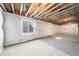 Spacious unfinished basement with insulation and a small window for natural light at , Aurora, CO 80019