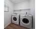 Laundry room features a new washer, dryer and shelving unit at , Aurora, CO 80019