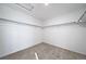 Spacious walk-in closet with ample hanging space and carpeted floor at , Aurora, CO 80019