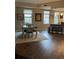 Dining area and open floor plan with warm wood floors and lots of natural light at 475 W 12Th Ave # 4E, Denver, CO 80204