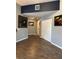 Hallway with neutral paint, hardwood floors, and framed art adorning the walls at 475 W 12Th Ave # 4E, Denver, CO 80204
