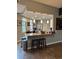 Open-concept kitchen with granite counters, stylish pendant lighting, and modern stainless steel appliances at 475 W 12Th Ave # 4E, Denver, CO 80204