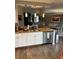 Kitchen with stainless appliances, a dishwasher, and a breakfast bar area with granite countertops at 475 W 12Th Ave # 4E, Denver, CO 80204