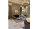 Relaxing luxury building lobby lounge area with a decorative fireplace and marble floors at 475 W 12Th Ave # 4E, Denver, CO 80204