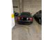 Garage parking with a Black Maserati parked in marked spot number 30 at 475 W 12Th Ave # 4E, Denver, CO 80204