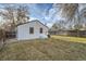 The backyard is grassy with a fence and a view of the home, creating a private outdoor space at 5235 Dover St, Arvada, CO 80002