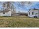 Large backyard showcasing a storage shed, well-kept lawn, and the back of a house at 5235 Dover St, Arvada, CO 80002