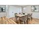Dining area with table and seating for six, closet and view to the outside at 5235 Dover St, Arvada, CO 80002