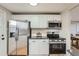 Kitchen featuring stainless steel appliances and modern countertops at 5235 Dover St, Arvada, CO 80002