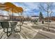 Picturesque town square featuring outdoor seating areas and mature trees on a sunny day at 5235 Dover St, Arvada, CO 80002