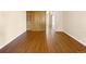 Bright living area featuring hardwood floors and a closet with built in drawers at 61 S Sable Blvd # C15, Aurora, CO 80012