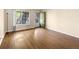 This bright living area has hardwood floors, a floor lamp, and window views at 61 S Sable Blvd # C15, Aurora, CO 80012