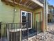 Private patio with sliding glass door and black metal railing offers outdoor space at 61 S Sable Blvd # C15, Aurora, CO 80012