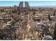 Scenic aerial shot of a quiet neighborhood, featuring tree-lined streets and a cityscape backdrop at 432 N Ogden St, Denver, CO 80218