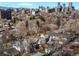 Expansive aerial view showcasing the neighborhood with a stunning city skyline and mountain backdrop at 432 N Ogden St, Denver, CO 80218